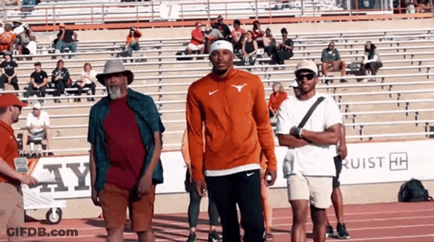 Man Walking Wearing Hook Em Jacket GIF