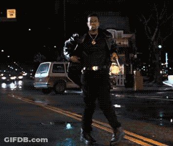Man Walking With Arms Outstretched Past No Parking Sign GIF