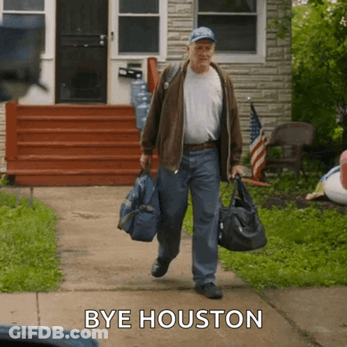 Man Walking With Bag Saying Bye Houston GIF