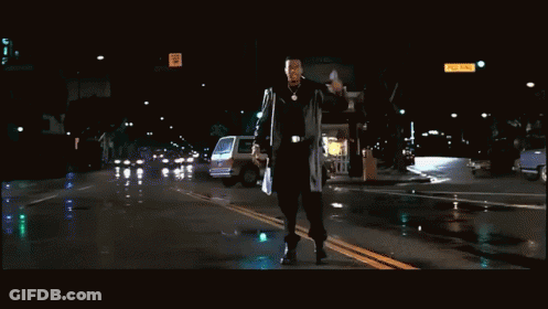 Man Walking With Freeway Sign GIF
