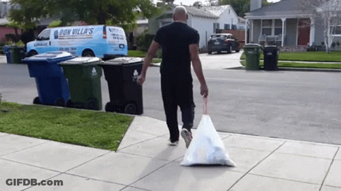 Man Walking With Garbage Bag In Front Of Van GIF