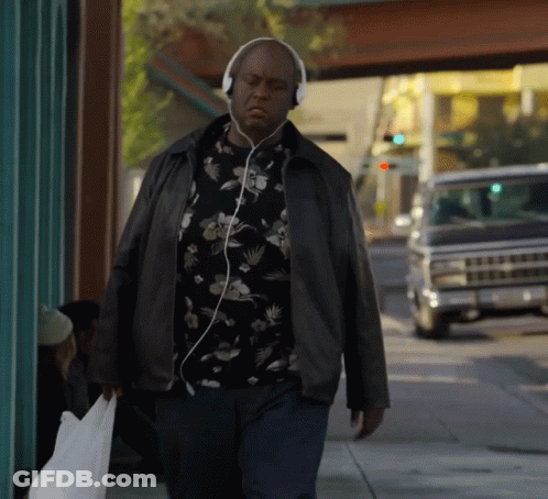 Man Walking With Headphones GIF