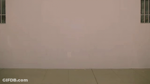 Man Walking With Link City Sign GIF
