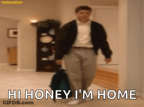 Man Walking With Suitcase Saying Hi Honey I'm Home GIF