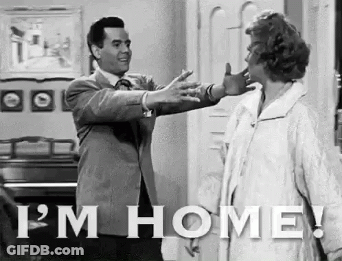 Man Walking With Suitcase Saying Hi Honey I'm Home GIF