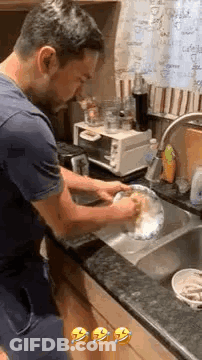 Man Washing Dishes In Kitchen Sink GIF
