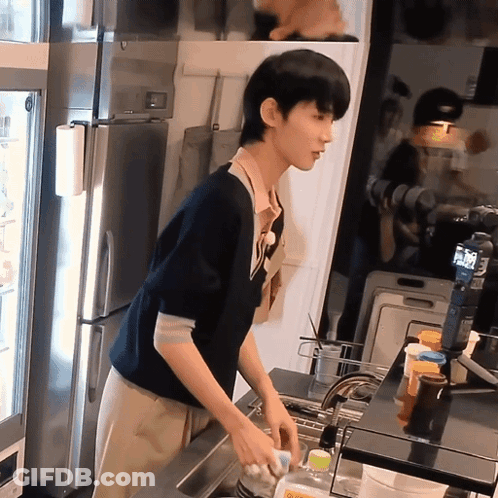 Man Washing Dishes In Kitchen With Coca Cola Bottle GIF