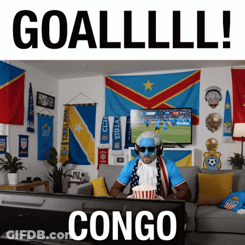 Man Watching Soccer On Couch Saying Congo GIF