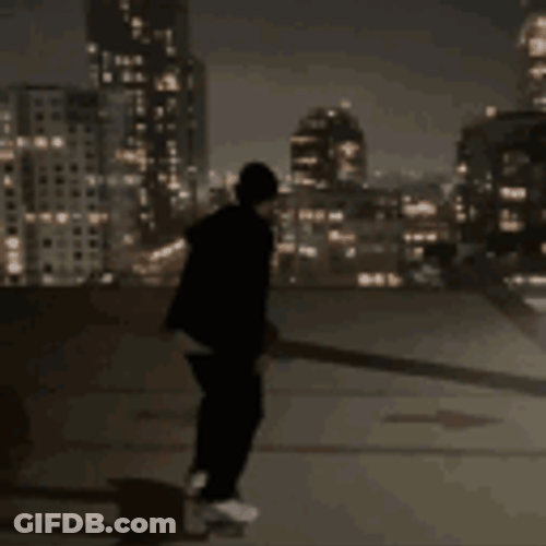 Man Watching Sparkling City Lights GIF