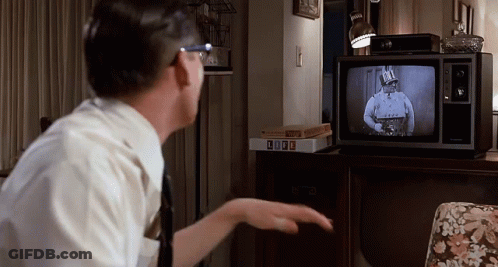 Man Watching TV With Box Of Life GIF