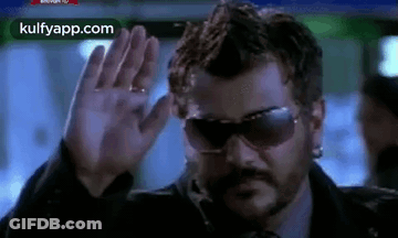Man Waving Hand In Sunglasses GIF