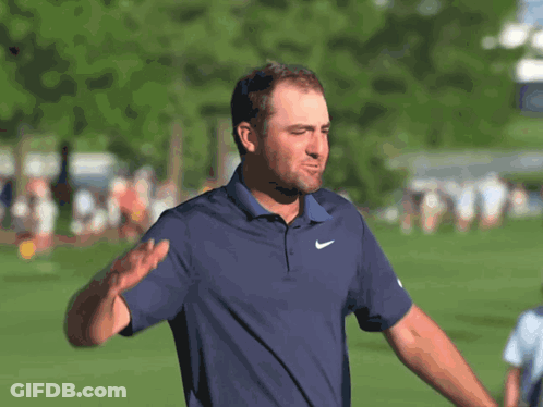 Man Waving In Blue Nike Shirt GIF