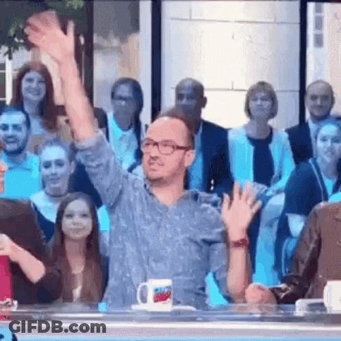 Man Waving To Crowd On TV Show GIF
