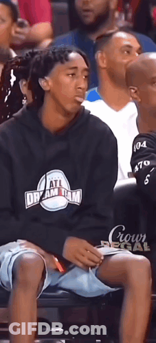 Man Wearing All Dream Team Sweatshirt Sits In Crowd GIF