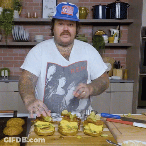 Man Wearing B.E.M. T-Shirt Preparing Food GIF