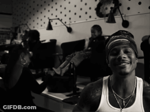 Man Wearing Bandana And White Tank Top Smiling GIF