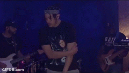 Man Wearing Bandana With Guitarist And Drummer GIF