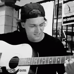 Man Wearing Baseball Cap Playing Guitar GIF