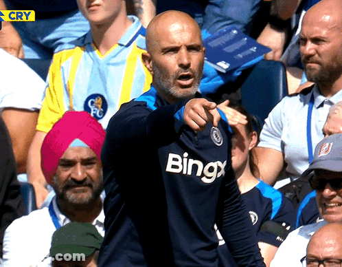Man Wearing Bingx Shirt Pointing GIF