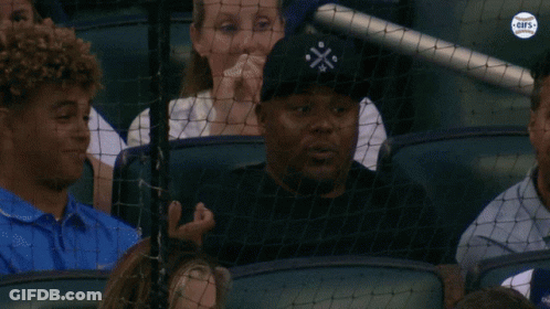 Man Wearing Black Cross Hat GIF