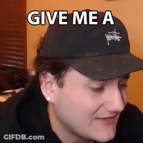Man Wearing Black Hat With Give Me A GIF