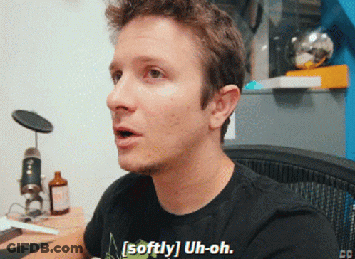 Man Wearing Black Shirt That Says Softly Uh-Oh GIF
