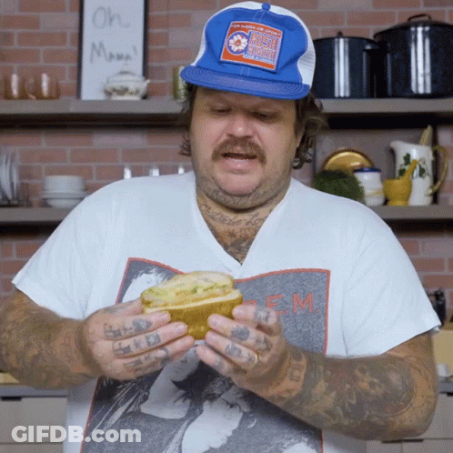 Man Wearing Blue Hat And EM Shirt GIF