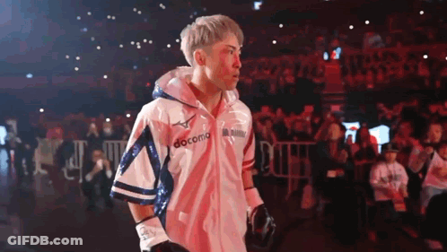 Man Wearing Boxing Gloves And Docomo Jacket GIF