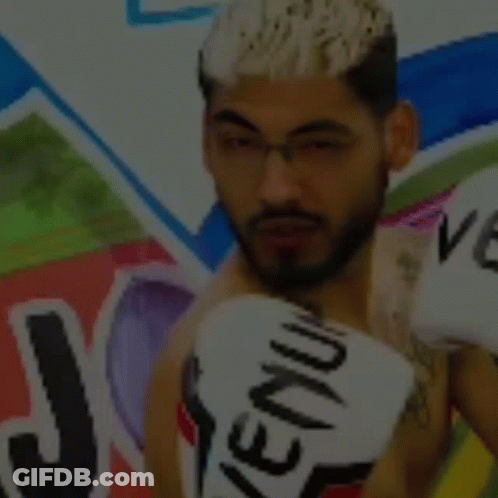 Man Wearing Boxing Gloves With Venum GIF