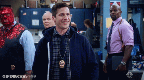 Man Wearing Brooklyn 99 Badge GIF