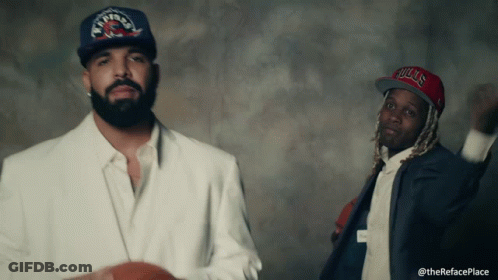 Man Wearing Bulls Hat Beside Another Man GIF