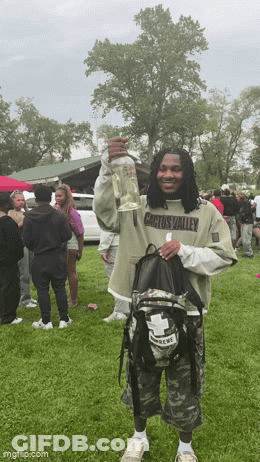 Man Wearing Cactus Valley Shirt Holding Bottle GIF