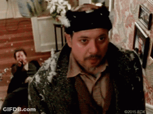 Man Wearing Cat Hat Standing In Living Room GIF