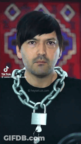 Man Wearing Chain With Padlock GIF
