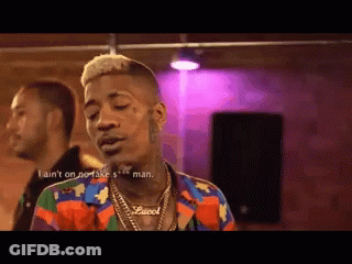 Man Wearing Colorful Gucci Shirt And Necklace GIF