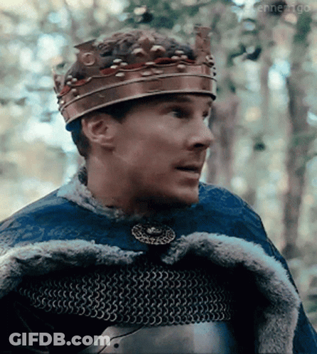 Man Wearing Crown And Chain Mail Looking Right GIF