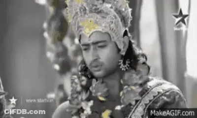 Man Wearing Crown And Garland GIF