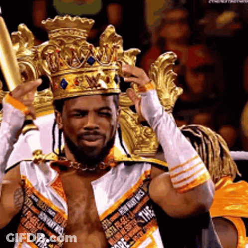 Man Wearing Crown And Gloves Holding Bat GIF