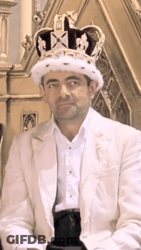 Man Wearing Crown And White Suit GIF
