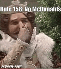 Man Wearing Crown Covering Mouth GIF