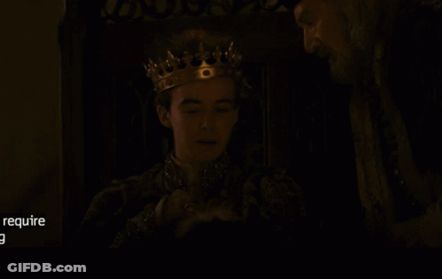 Man Wearing Crown Talking To Another Man GIF