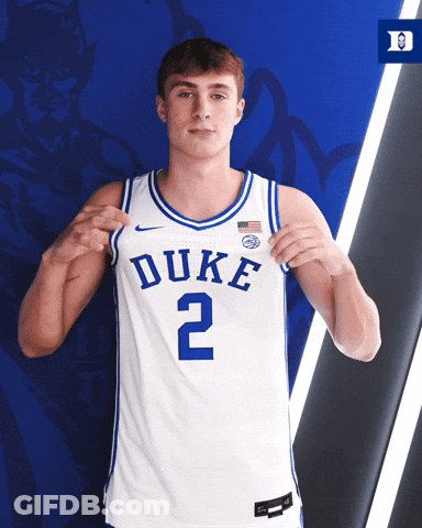Man Wearing Duke Jersey Holding Up Jersey GIF