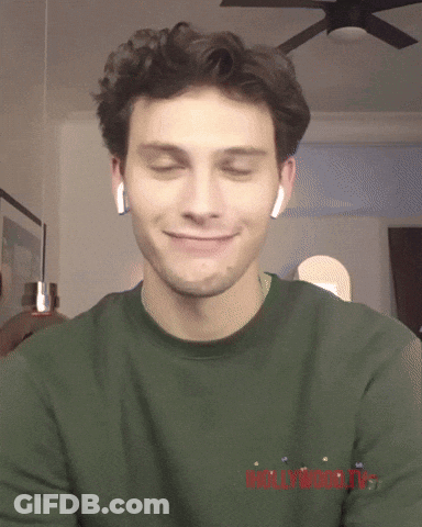 Man Wearing Ear Buds And Green Shirt Saying Hollywood GIF