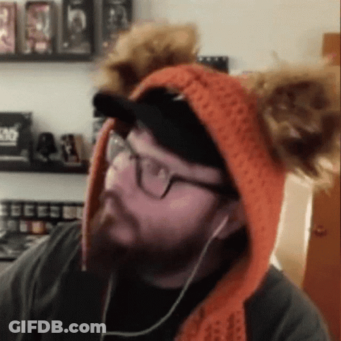 Man Wearing Eared Hat And Headphones GIF