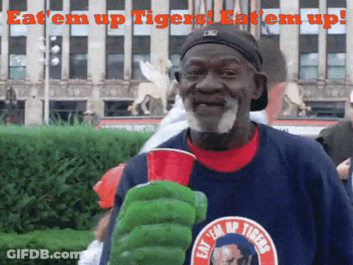 Man Wearing Eat Em Up Tigers Shirt GIF