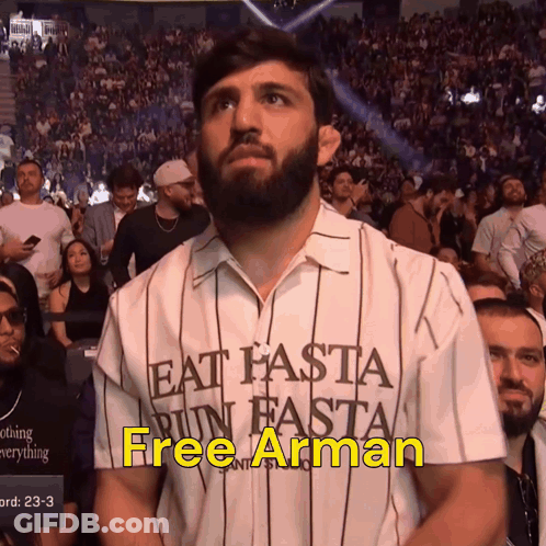 Man Wearing Eat Hasta Run Hasta Shirt GIF