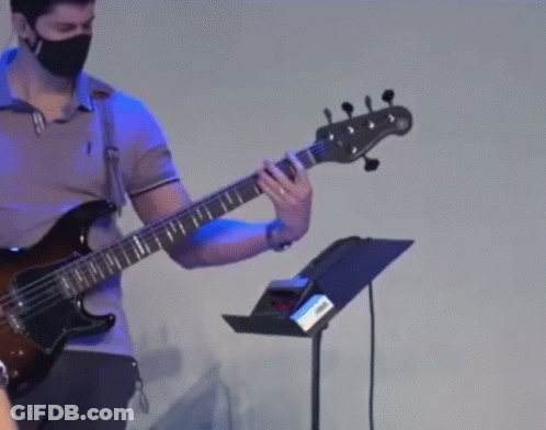 Man Wearing Face Mask Playing Guitar GIF