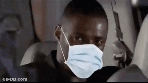 Man Wearing Face Mask Sitting On Plane GIF
