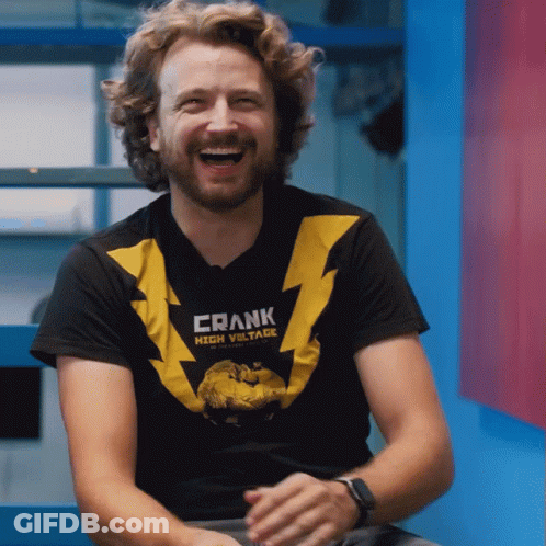 Man Wearing Frank High Voltage T-Shirt Laughs GIF