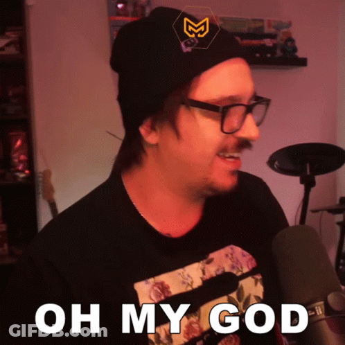 Man Wearing Glasses And Beanie Saying Oh My God GIF